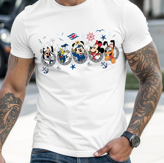 Person wearing a white t-shirt with cartoon characters and text, with tattoos on arms.